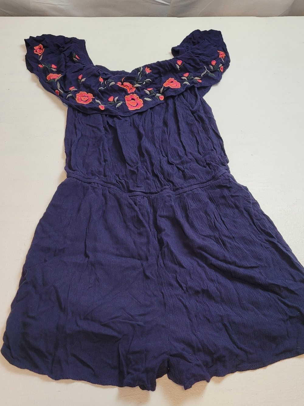 Dizzy Lizzy rayon romper featuring floral rose embroidery
